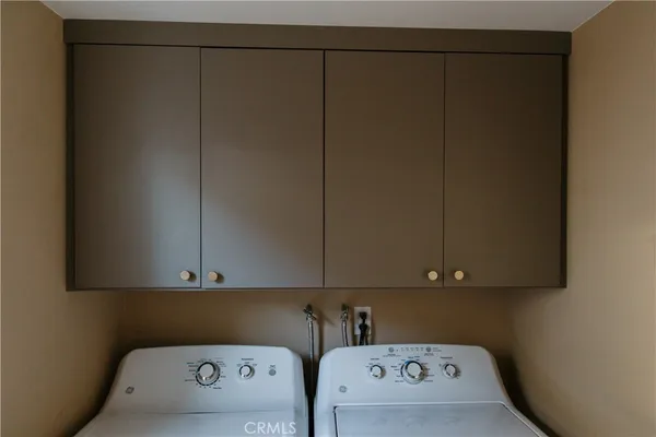 a large bed sitting in a bedroom next to a tv