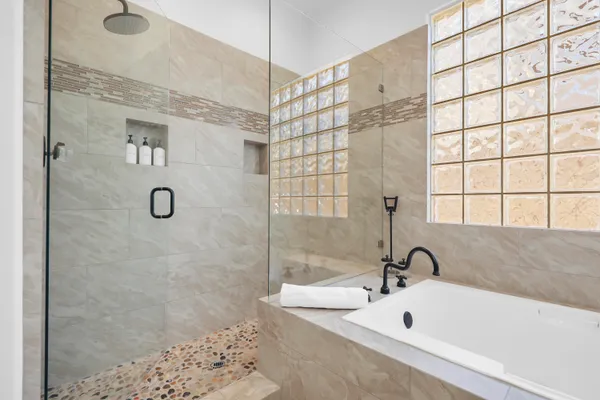 a bathroom with a tub and a sink