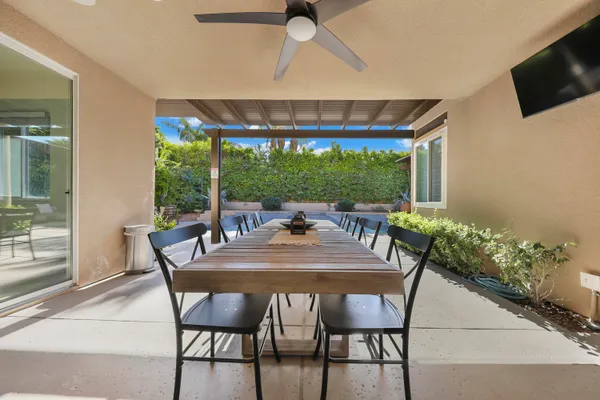 a view of a dining room with furniture window and outside view
