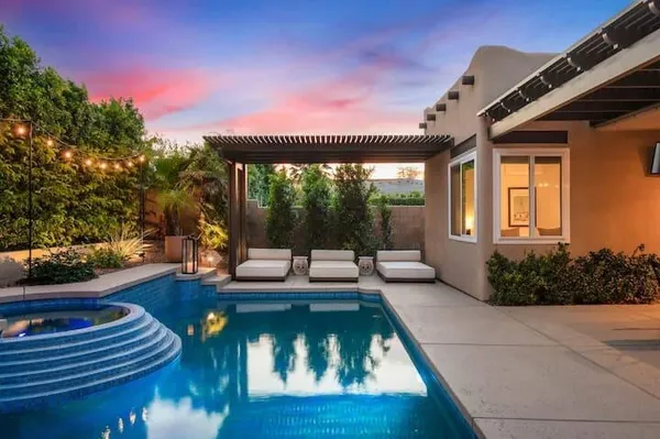 a view of swimming pool with lounge chair