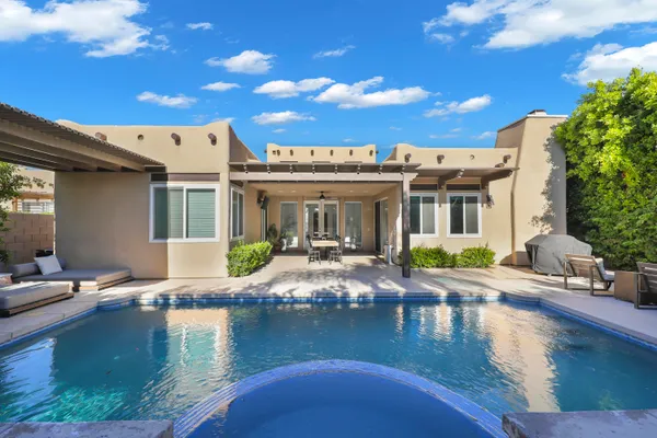 a view of a house with swimming pool