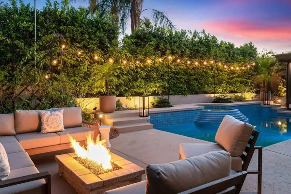 a outdoor sitting area with furniture and a potted plant