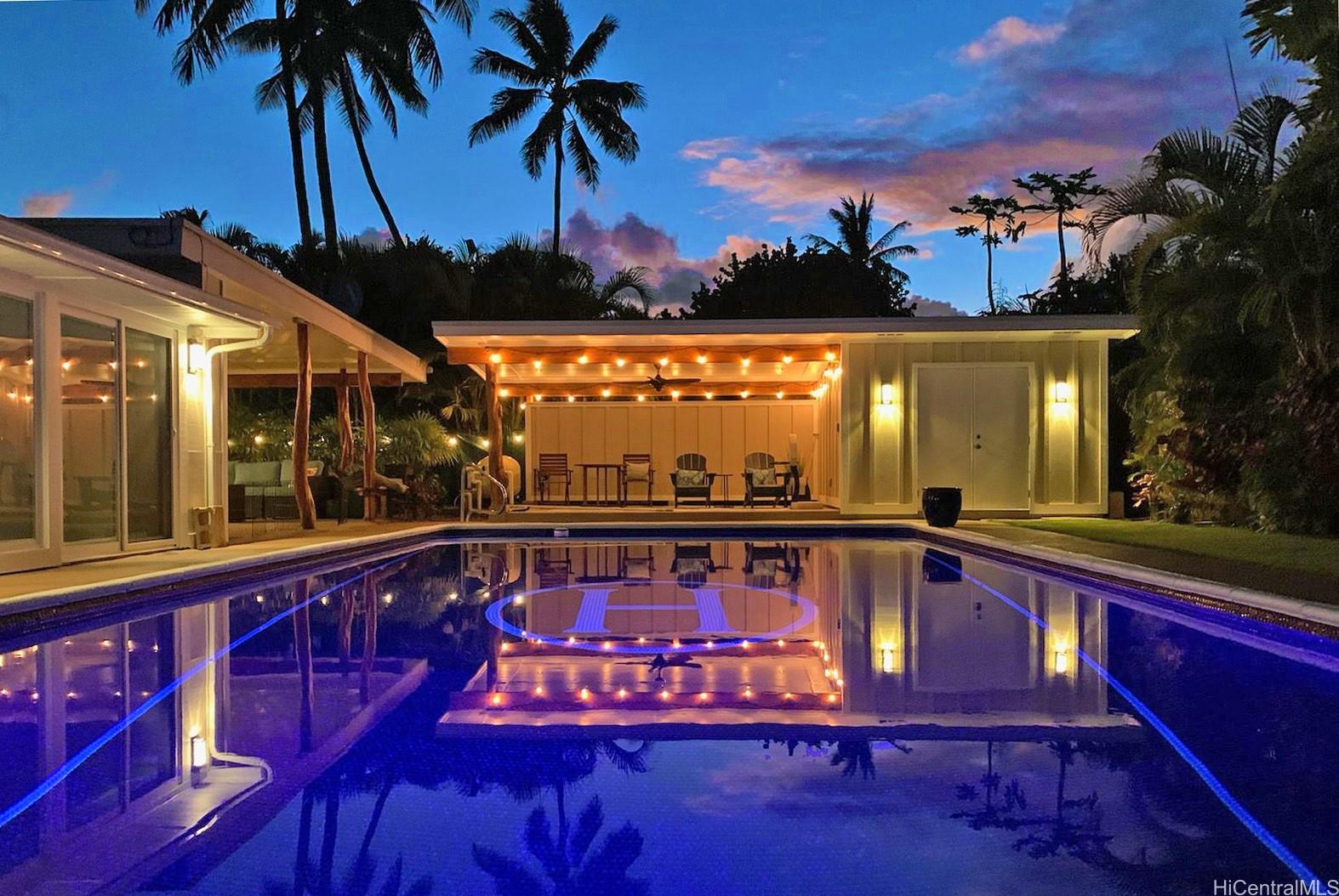 a view of swimming pool with a patio