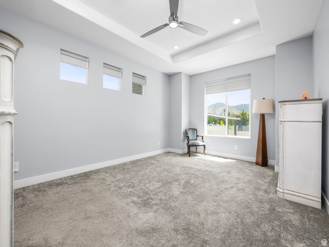 877 South Yarrow Drive Mapleton, UT 84664 - Photo 10 of 46 Spacious interior room featuring a tray ceiling with recessed lighting and a ceiling fan