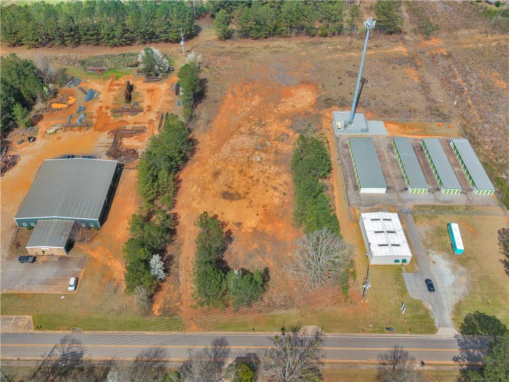 0 County Farm Road Williamson, GA 30292 - Photo 6 of 7 an aerial view of a house with a lake view