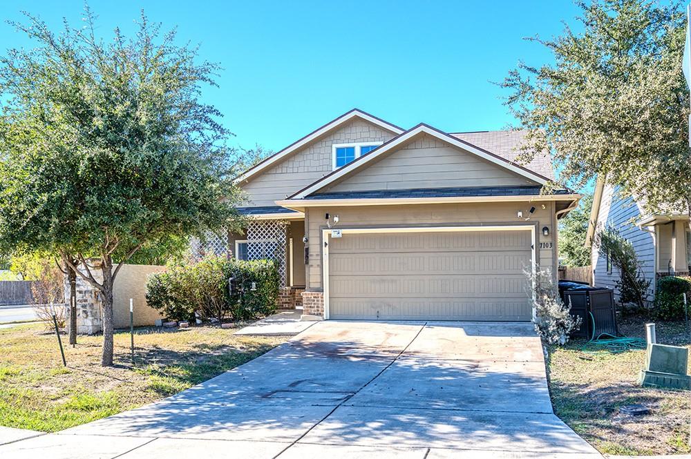 7103 Azalea Square San Antonio, TX 78218 - Photo 1 of 21 a front view of a house with a yard and garage