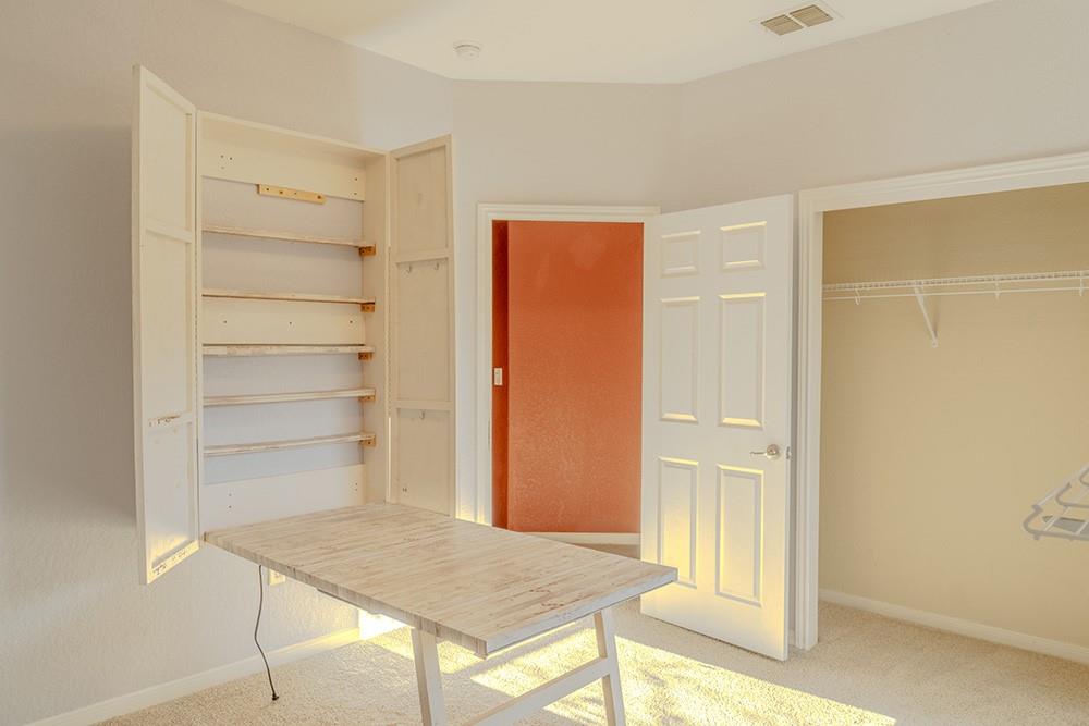 7103 Azalea Square San Antonio, TX 78218 - Photo 12 of 21 an empty room with cabinet and wooden floor
