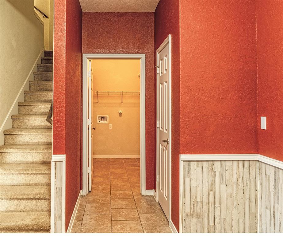 7103 Azalea Square San Antonio, TX 78218 - Photo 13 of 21 a view of a hallway with wooden floor and a door