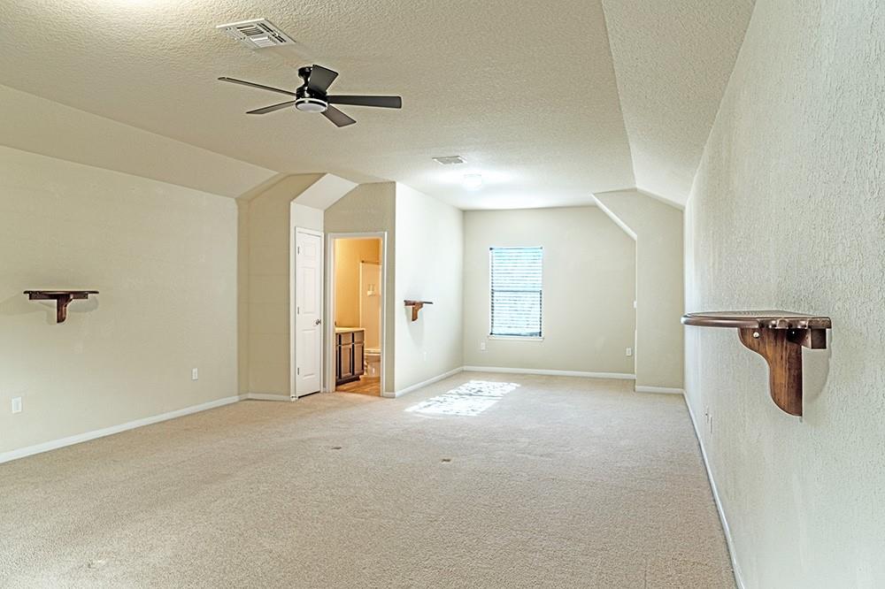 7103 Azalea Square San Antonio, TX 78218 - Photo 14 of 21 a view of a livingroom with a ceiling fan and window