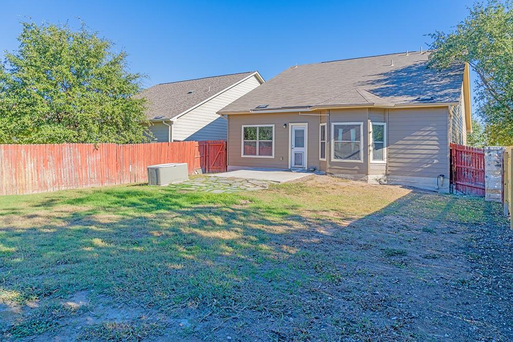 7103 Azalea Square San Antonio, TX 78218 - Photo 17 of 21 a view of a yard in front of a house with plants