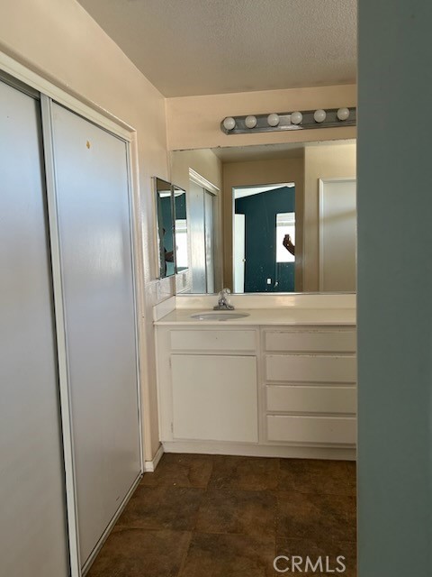 1474 Albillo Loop Perris, CA 92571 - Photo 7 of 13 a bathroom with a sink vanity and mirror