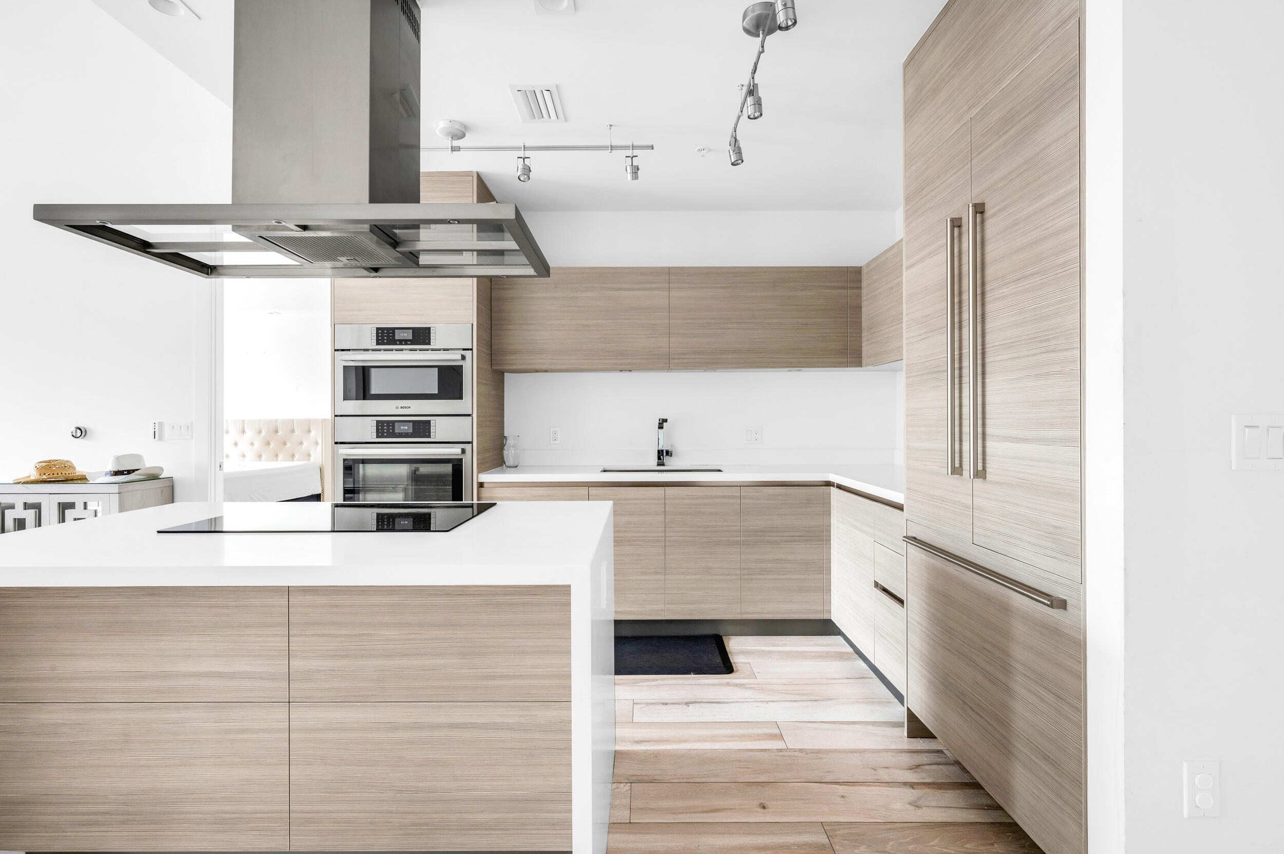 155 East Boca Raton Road, Unit 418 Boca Raton, FL 33432 - Photo 2 of 51 a kitchen with stainless steel appliances kitchen island granite countertop a sink and stove