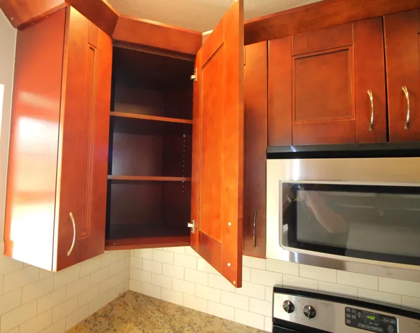 a view of washer and dryer with wooden floor