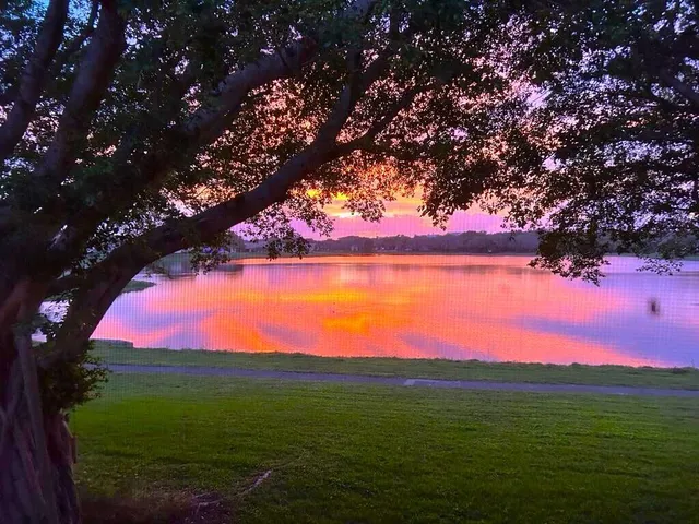 a view of a lake with a big yard