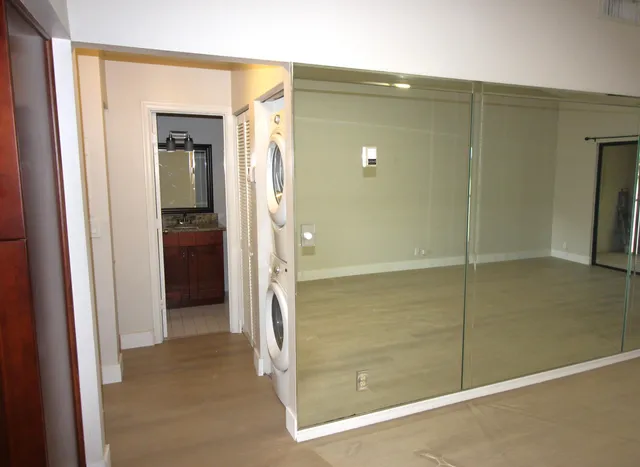 a bathroom with a shower and a glass door
