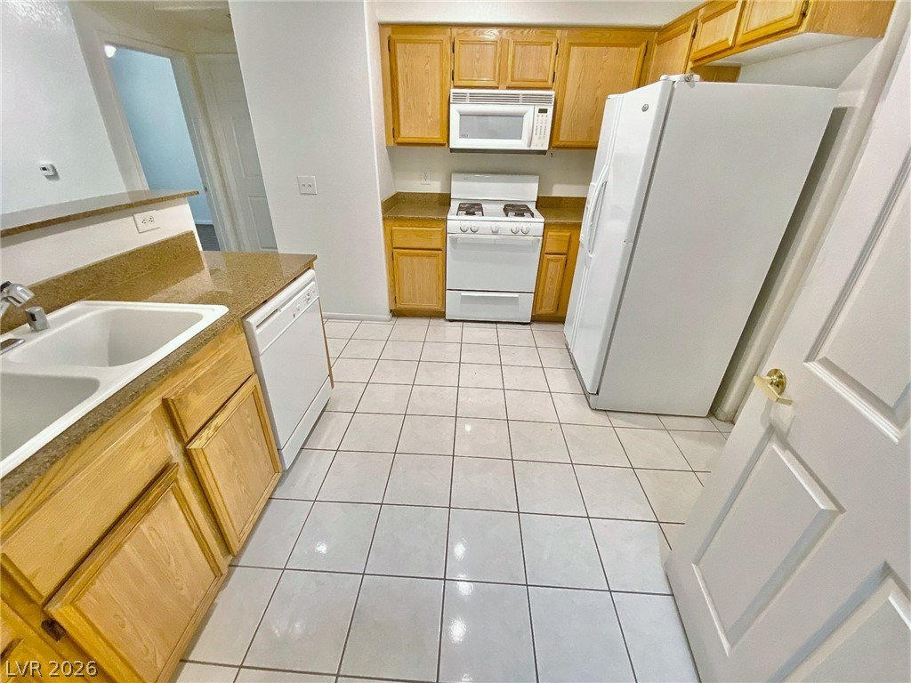 10550 West Alexander Road, Unit 1131 Las Vegas, NV 89129 - Photo 5 of 18 A well-appointed kitchen features ample counter space and full-sized appliances.