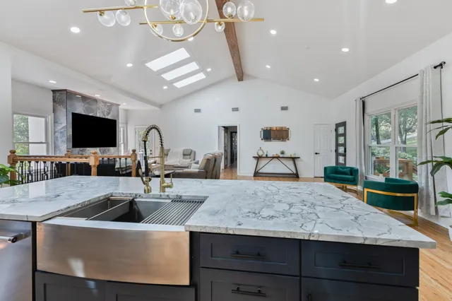 a kitchen with a stove and a sink
