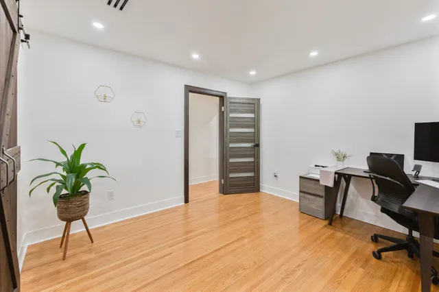 a workspace with furniture and wooden floor