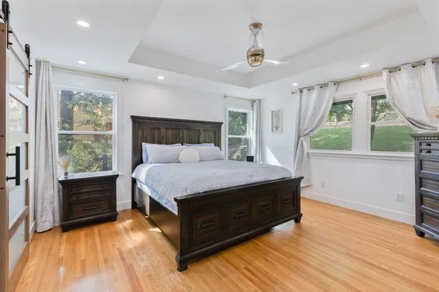a room with a bed and a view of balcony