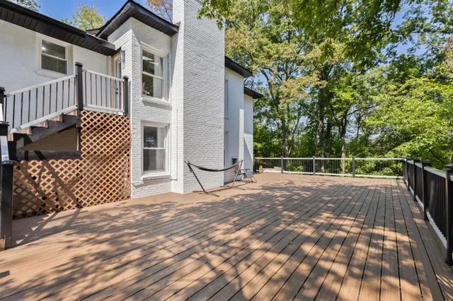 a view of a backyard with a wooden fence