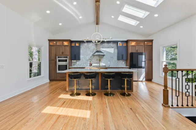 an open kitchen with a table and chairs