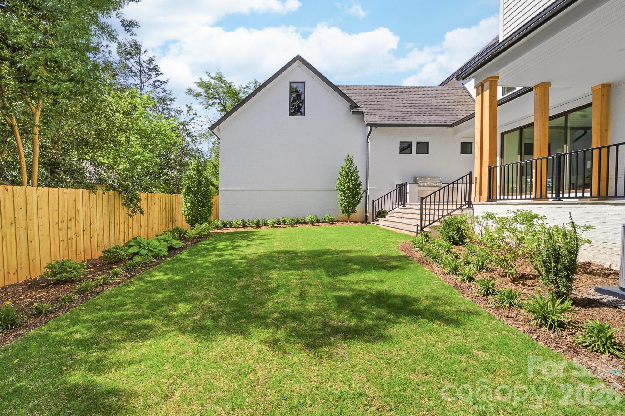 216 Walnut Street Davidson, NC 28036 - Photo 45 of 48 a view of a house with a yard and sitting area