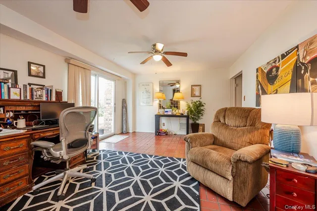 a living room with furniture rug and window