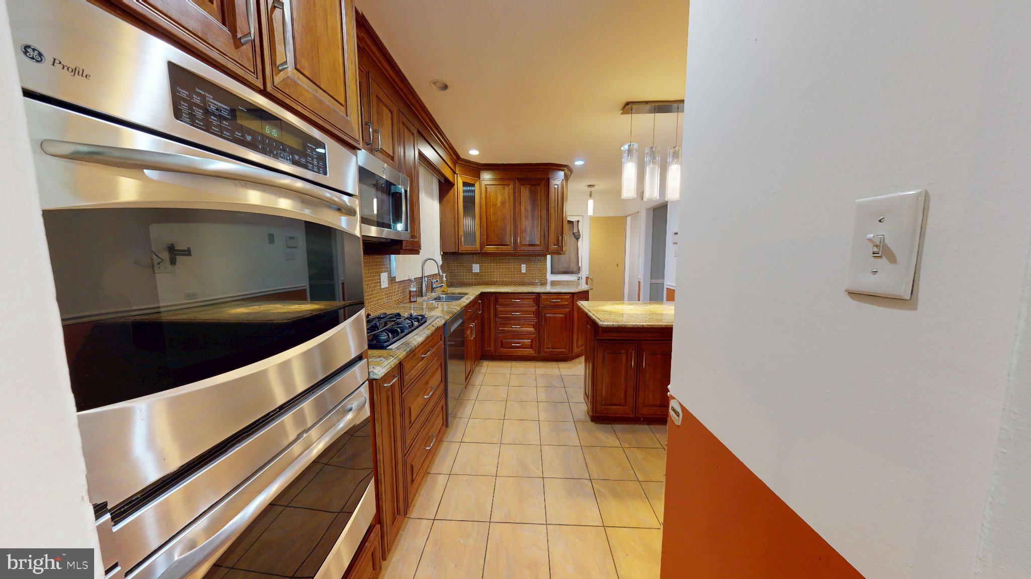 669 North Henderson Road King of Prussia, PA 19406 - Photo 12 of 84 Elegant kitchen with rich cabinetry.