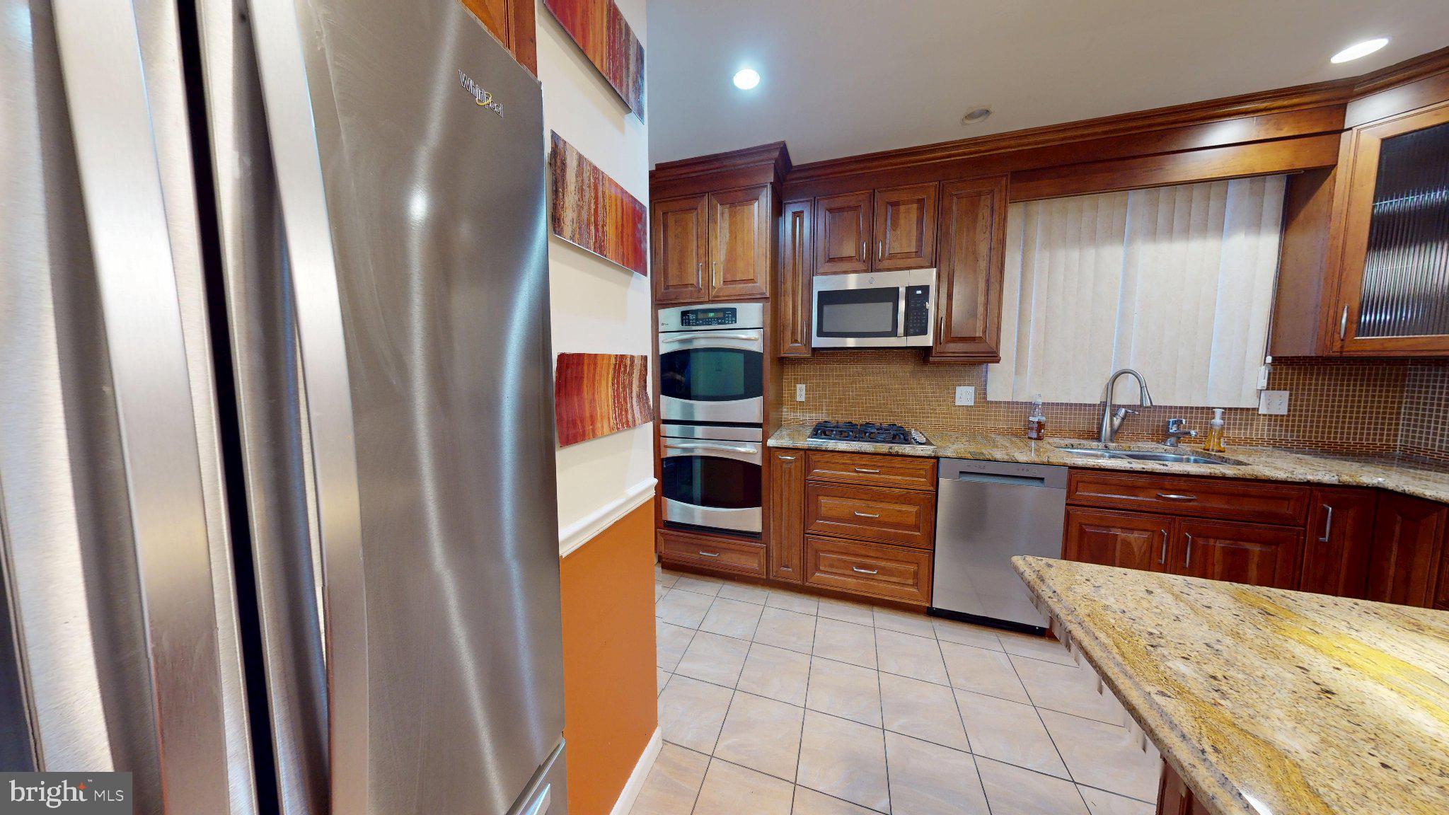 669 North Henderson Road King of Prussia, PA 19406 - Photo 13 of 84 Modern kitchen with rich wood accents.