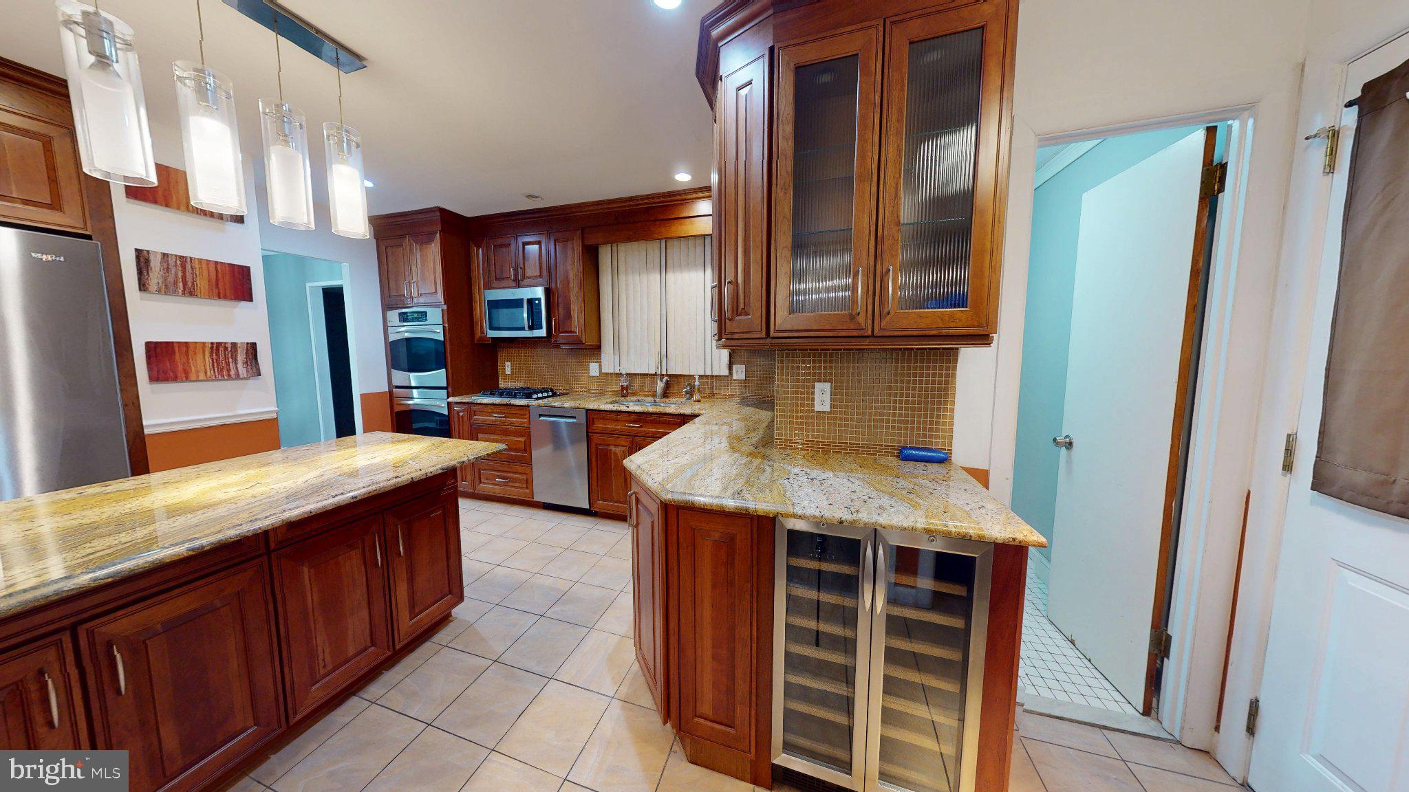 669 North Henderson Road King of Prussia, PA 19406 - Photo 15 of 84 Elegant kitchen with rich wood accents.