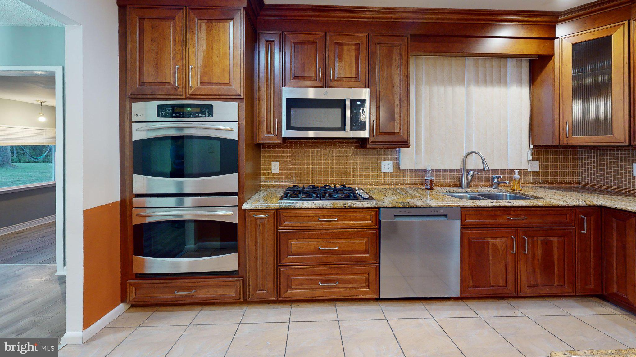 669 North Henderson Road King of Prussia, PA 19406 - Photo 67 of 84 Elegant kitchen with rich wood finishes.
