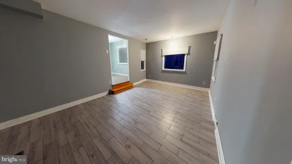a view of livingroom with window and hardwood floor
