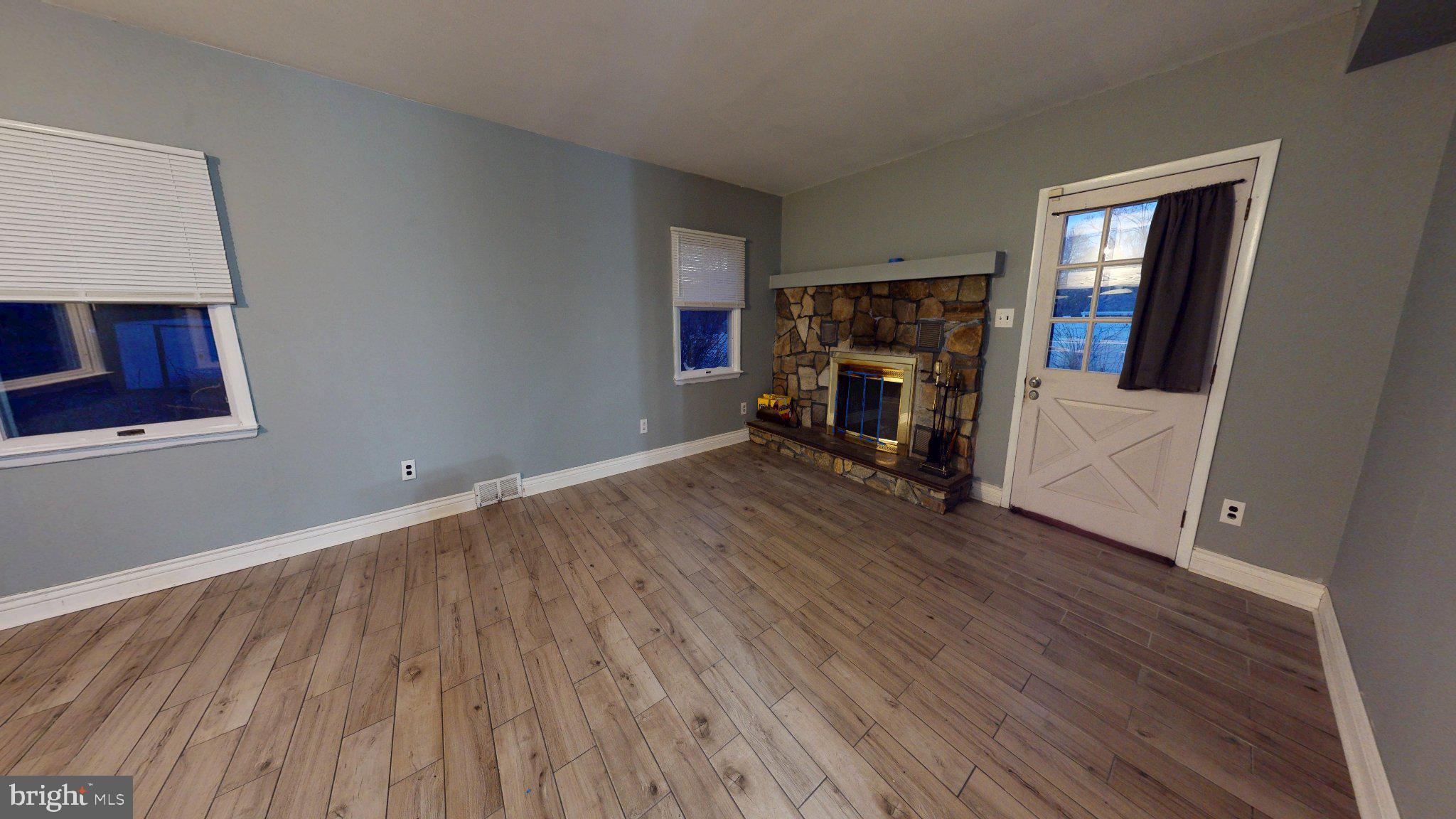 669 North Henderson Road King of Prussia, PA 19406 - Photo 9 of 84 Cozy living space with stone fireplace.