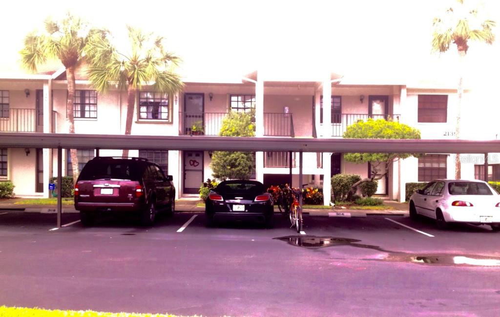 2139 Elm Street, Unit 303 Dunedin, FL 34698 - Photo 1 of 1 Front of building unit on the first floor center.