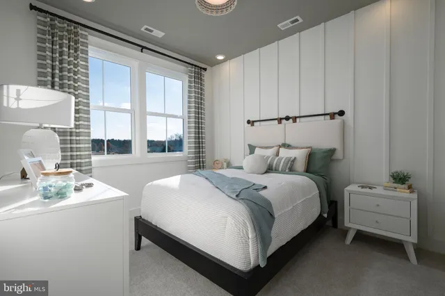 a bedroom with a bed and a table