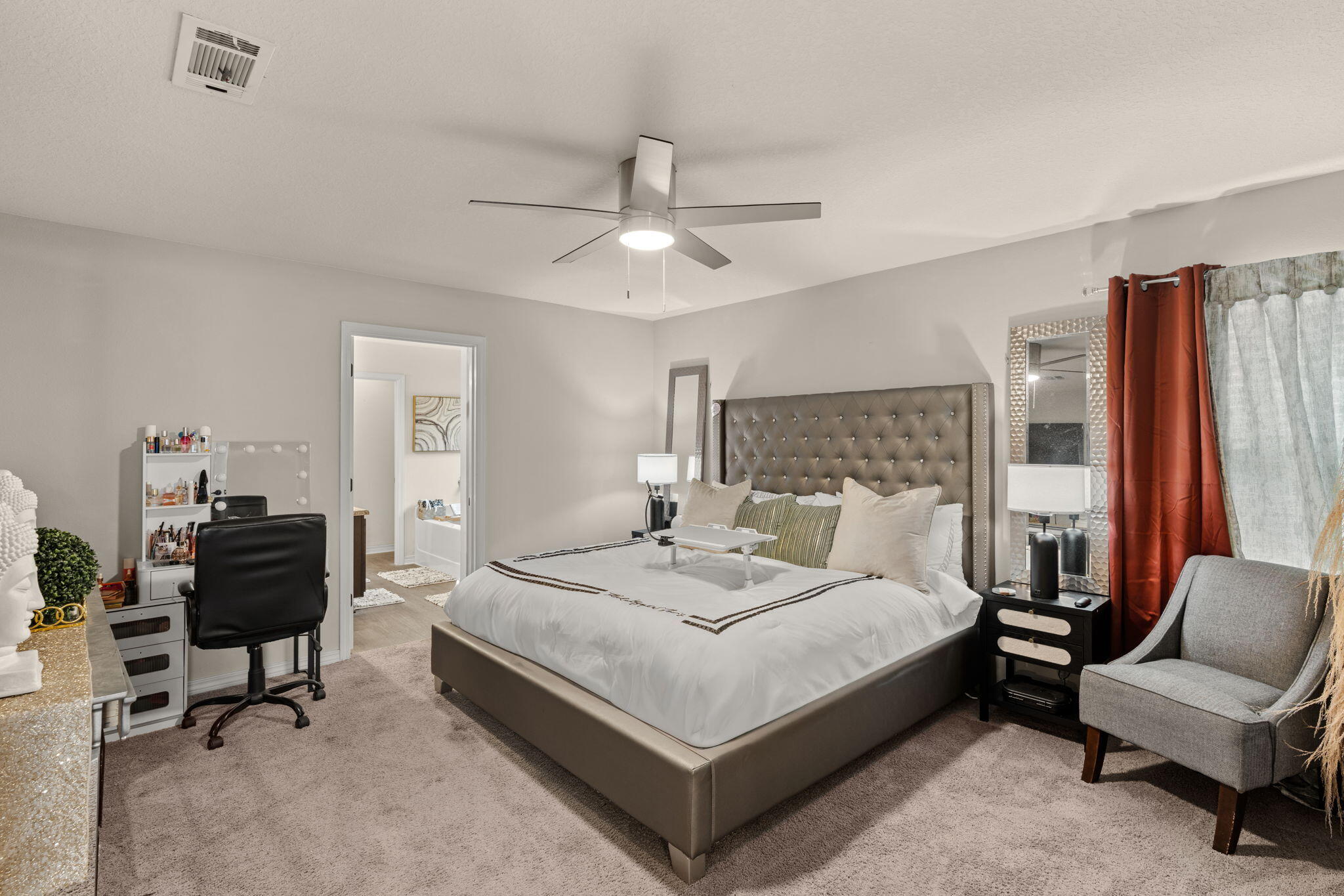 124 Lillian Way Crestview, FL 32536 - Photo 18 of 31 a bedroom with a bed and a chandelier