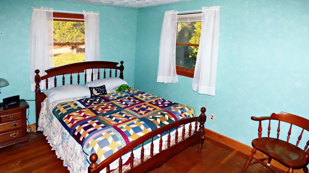 115 Richard Drive Hanover, MA 02339 - Photo 12 of 18 a bed sitting in a bedroom next to a window