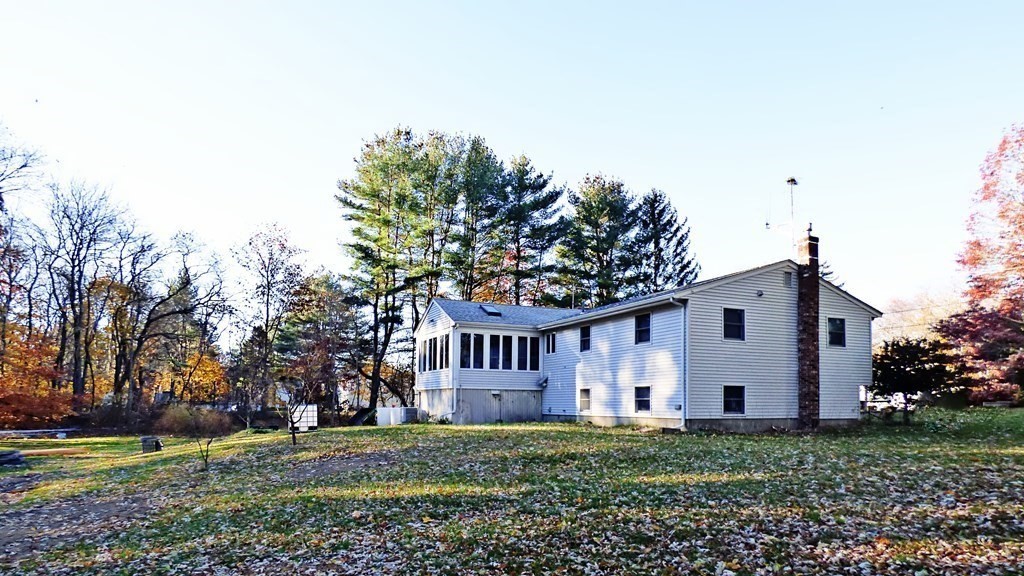 115 Richard Drive Hanover, MA 02339 - Photo 17 of 18 a front view of a house with a garden