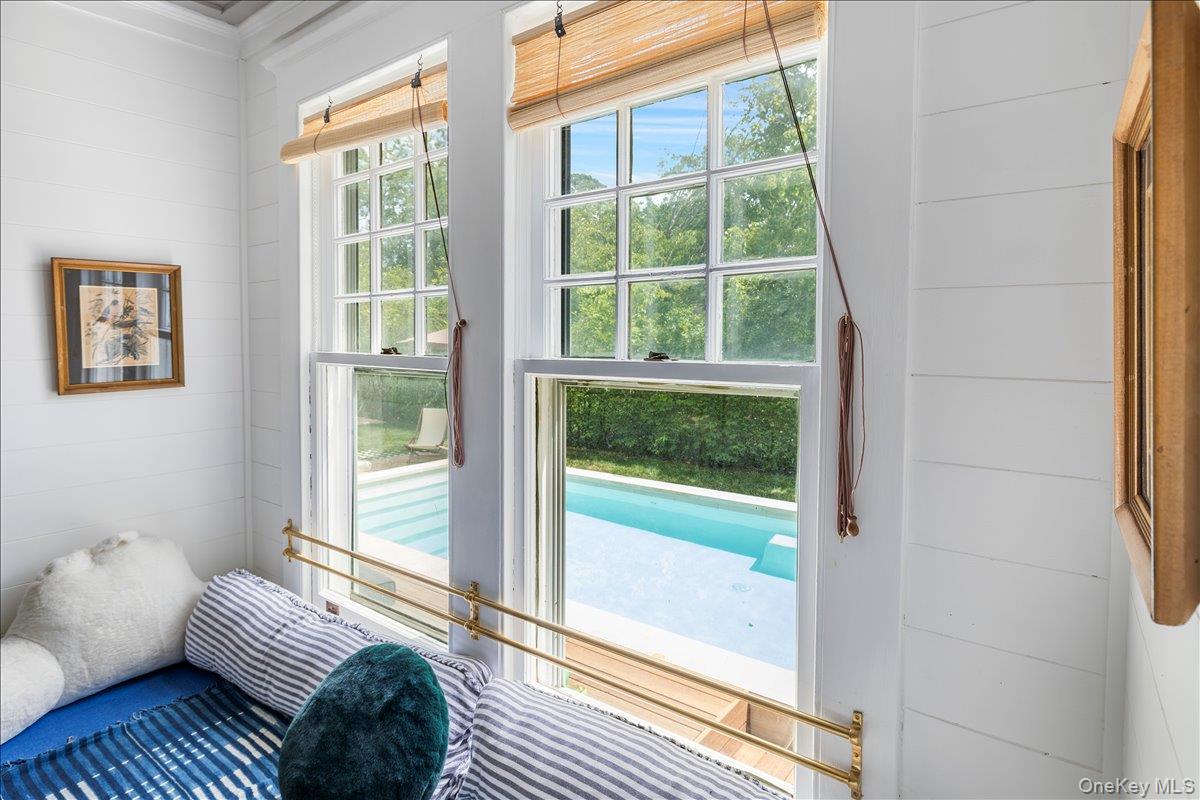 19 New Jersey Avenue Bellport, NY 11713 - Photo 12 of 17 a living room with furniture and a window