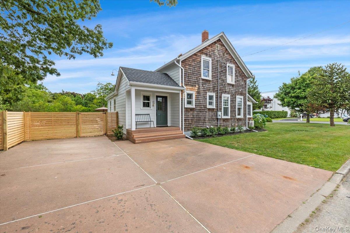 19 New Jersey Avenue Bellport, NY 11713 - Photo 3 of 17 a front view of a house with a yard