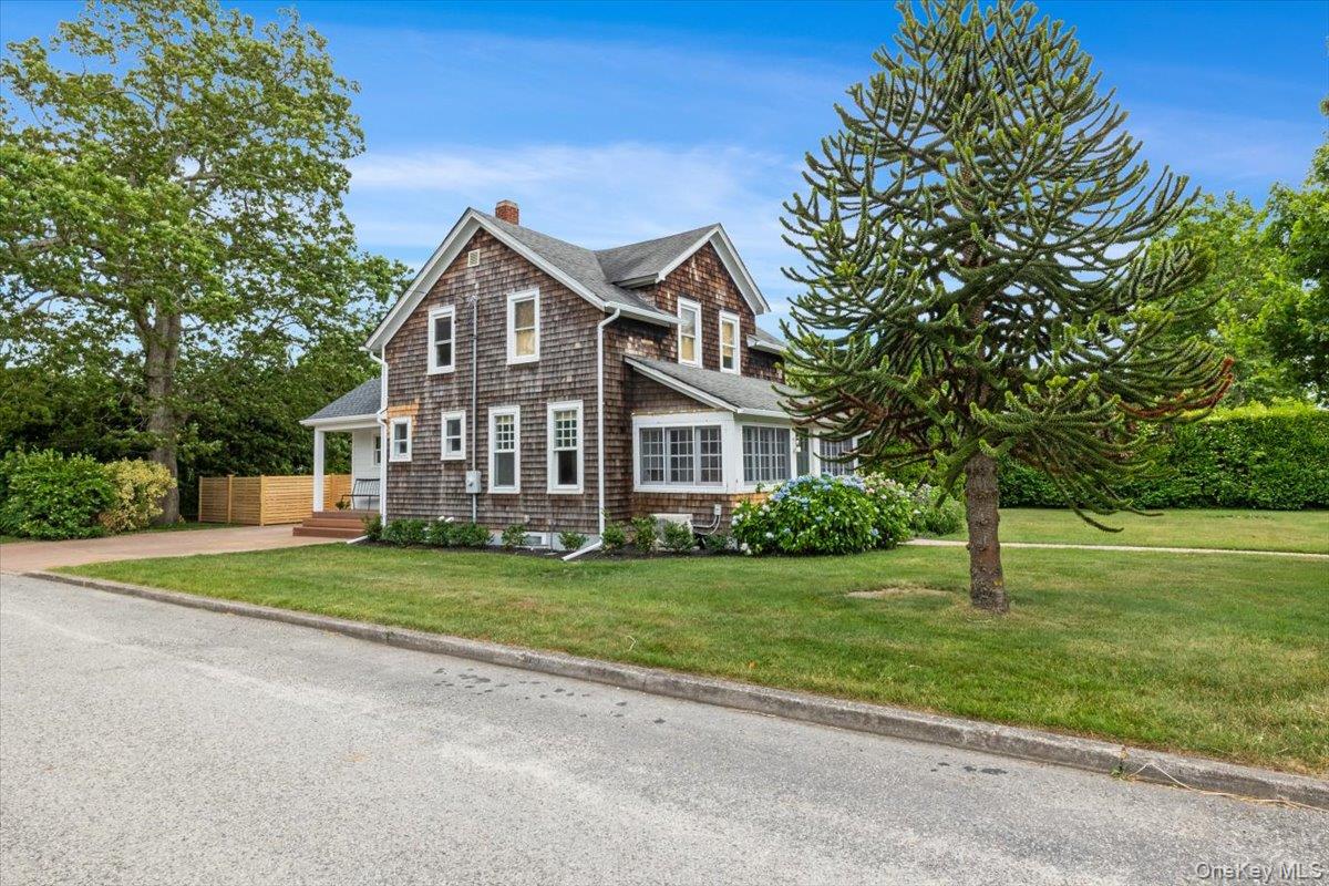 19 New Jersey Avenue Bellport, NY 11713 - Photo 4 of 17 a front view of a house with a yard