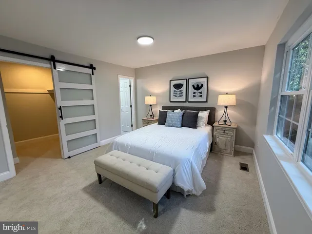 a bedroom with a bed and a cabinets