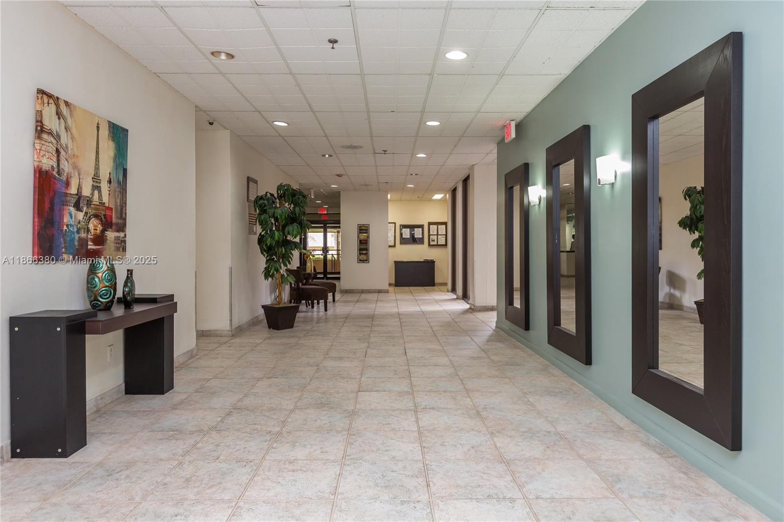 a view of a big room with closet and windows