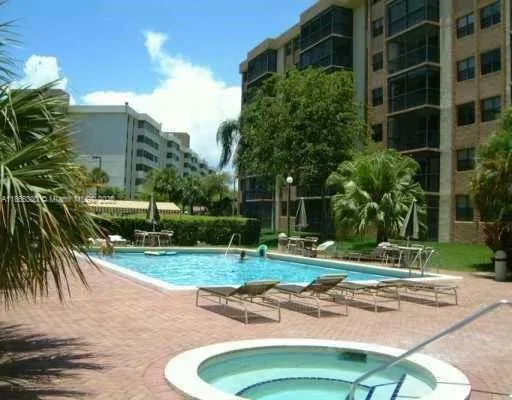 a bedroom with a bed and lamp