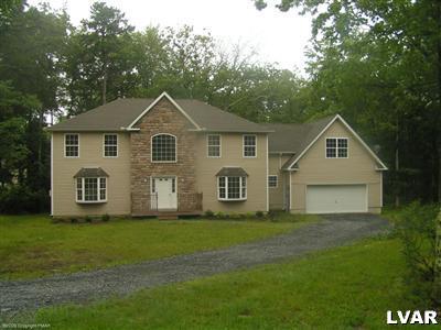 128 Withywindle Way Bushkill, PA 18324 - Photo 1 of 4 a front view of house with yard and green space