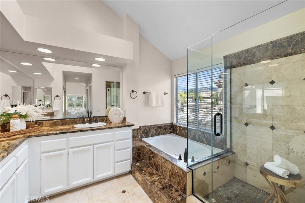 2 Minikahda Trabuco Canyon, CA 92679 - Photo 23 of 41 a spacious bathroom with a granite countertop sink a mirror a bathtub and shower