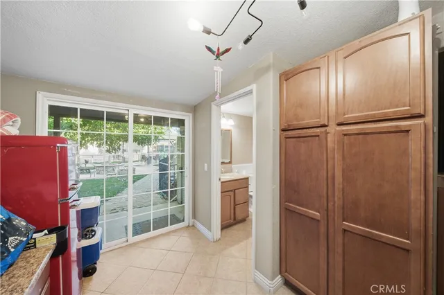 a view of a refrigerator and window in a room