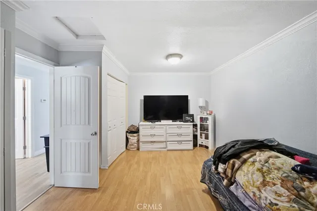 a view of a livingroom with furniture and a flat screen tv