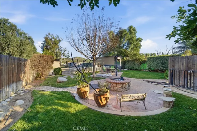 a view of a backyard with sitting area