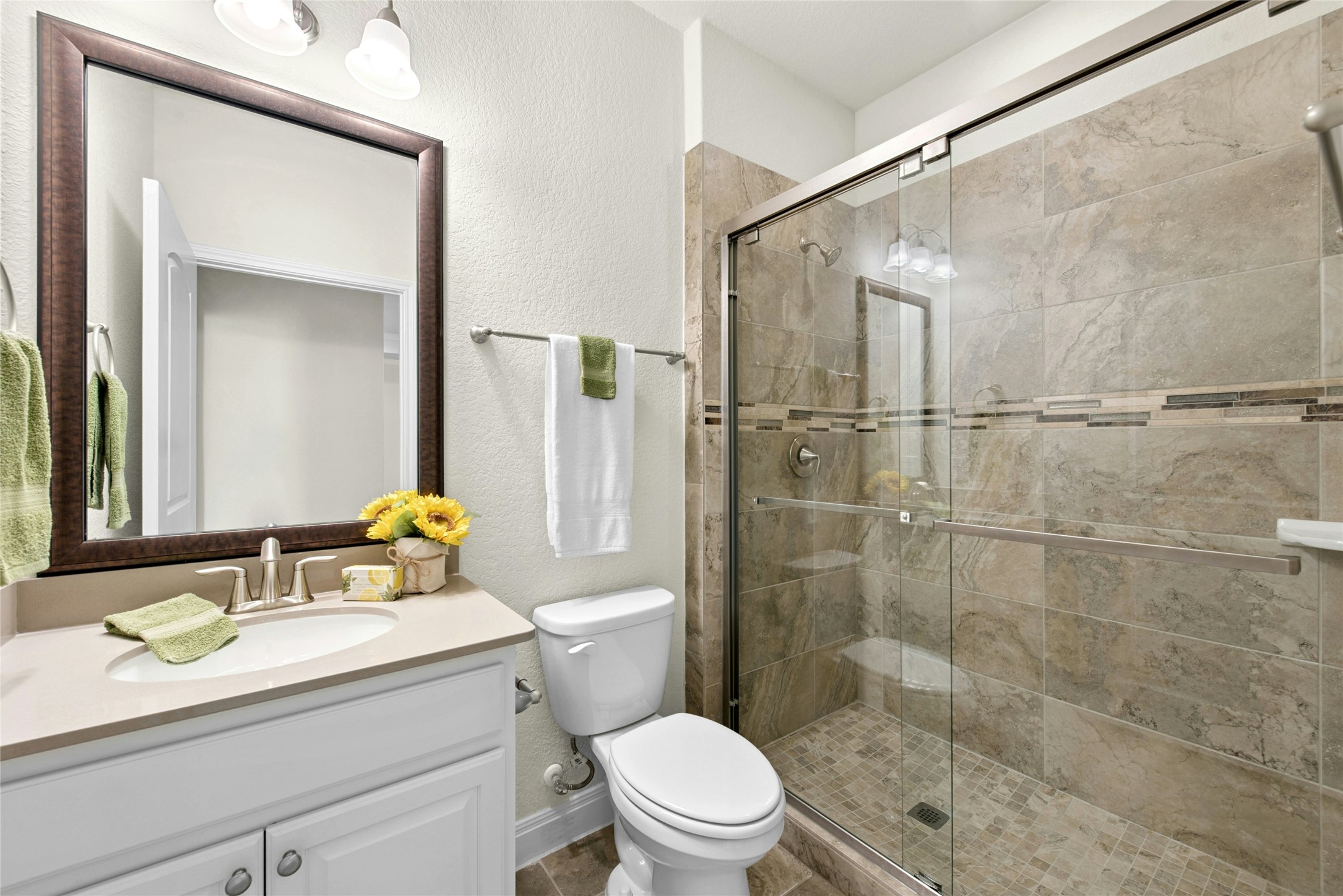 105 Marfa Cove Georgetown, TX 78633 - Photo 26 of 36 a bathroom with a sink a toilet and shower